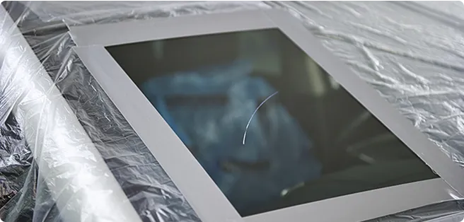 Displayed is a device afixing a mirror to the door.